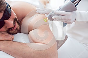 Man in a hair removal studio photo