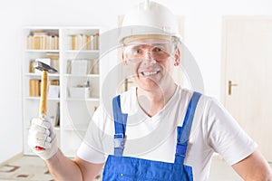 Man with hammer weraing protective suit