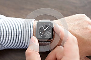 Man hand with Apple Watch on the desk