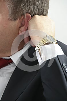 Man with hand behind head