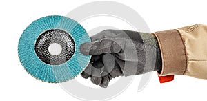 Man hand in black protective glove and brown uniform holding by fingers blue abrasive flap disc for grinding isolated on white