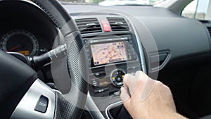 Man hand changing manual gearbox lever - dual climate - ac vents and navigation display photo
