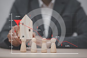 Man hand choosing mini wood house model from model on wood table, Planning buy Real Estate, Planning to buy property, Planning to