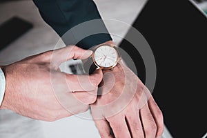 man hand clock on computer keyboard background.