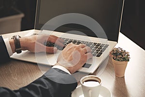 Man hand computer keyboard on office desk.