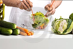 Man hand cook make mix vegetables salad on kitchen