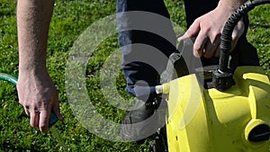 Man hand detach water hose to high pressure wash equipment