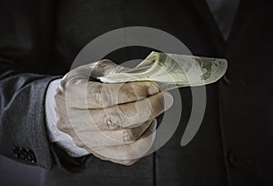 man hand with Euro money for Venality, bribe, corruption concept as Hand giving money