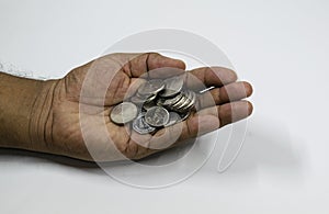 A man hand with full of UAE coins with white background, fils