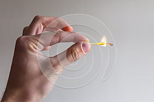 Man hand gesture with fire match