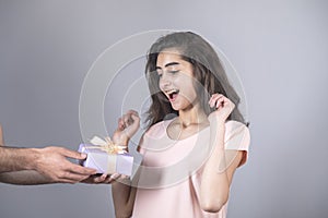 Man hand gift box and surprised woman