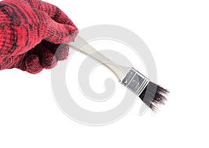 Man hand in glove holding paint brush on a white background