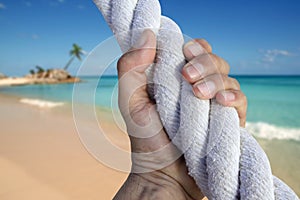 Man hand grab grip adventure paradise beach rope