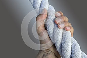 Man hand grab grip strong big aged rope photo