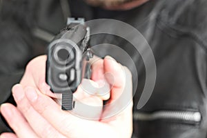 Man with hand gun pistol rubber attack violence