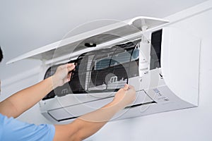 Man hand hold air conditioner filter cleaning concept