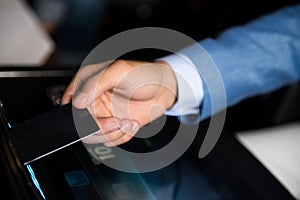 Man Hand Hold Card on Slot Machine Closeup