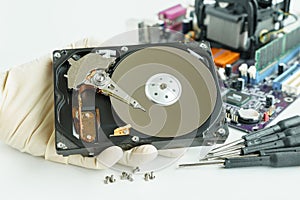 man hand hold hard disk drive for checking