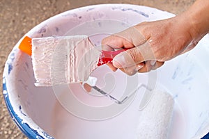 Man hand holder with paint brush