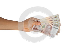 Man hand holding 5000 baht Thai banknote isolated on white background