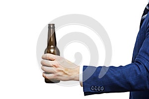A man hand holding beer bottle on white background. A hand holding up a beer bottle without label
