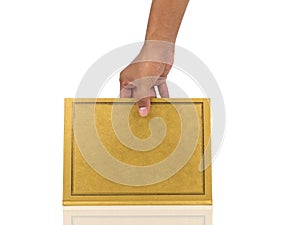 Man hand holding Book with gold cover on white background.