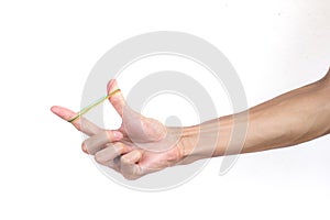 A man hand holding elastic rubber band on white background.