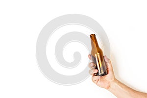 Man hand holding a empty bottle of beer