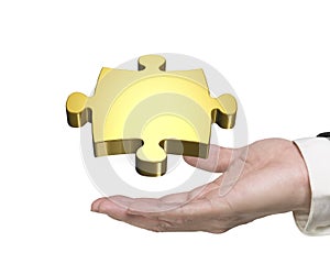 Man hand holding golden puzzle piece