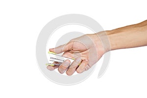 Man hand holding green metal stapler ready to stapling isolated on white background with clipping path