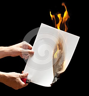 Man hand holding lighter and burned paper