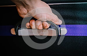 Man hand holding luggage case