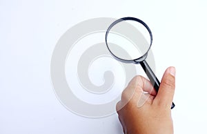 Man hand holding  Magnifying glass  isolate on a white background