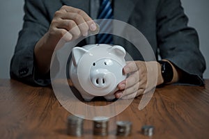 Man hand holding piggy bank, saving money wealth and financial concept, Business, finance, investment, Financial planning