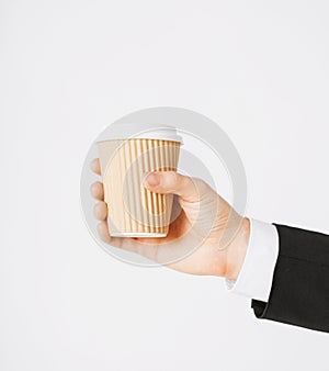 Man hand holding take away coffee