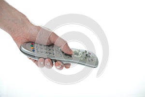 Man Hand holding a TV remote control over white