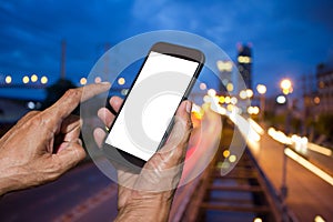 Man hand holding and using mobile,cell phone,smart phone with isolated screen.