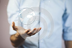 Man hand holding virtual sphere globe