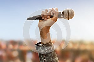 Man hand holding wireless microphone