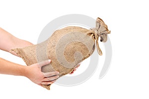 Man hand holds full tied up sack.