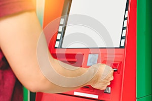 Man hand inserting debit or credit card to withdraw money with A