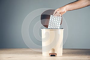 Man hand keyboard on the trash