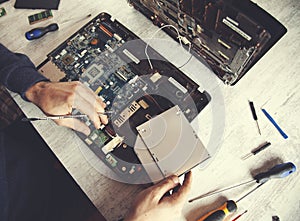 Man hand laptop disassembling