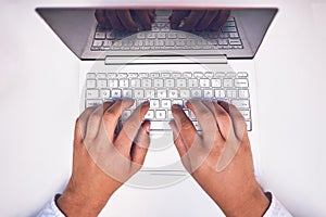 Man hand on laptop keyboard with blank screen monitor