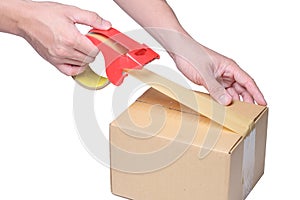 Man hand packing box with tape on cardboard box.