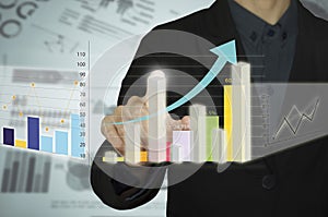 Man hand with pen drawing a graph chart and business strategy as concept on whiteboard