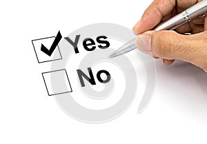 Man hand with pen over document, select Yes.