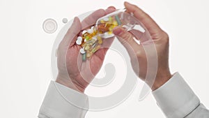 Man hand with pills, tablets, vitamins, drugs, capsules isolated on white background. White shirt, business style. Health care con