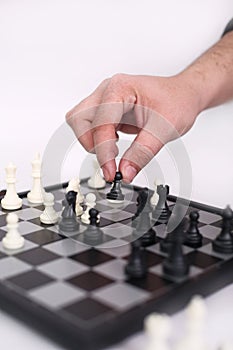 Man hand is playing chess