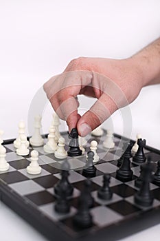 Man hand is playing chess